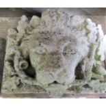 A reclaimed wall/fountain head with deep lions mask acorn and oak leaf detail, 44 cm wider x 30 cm