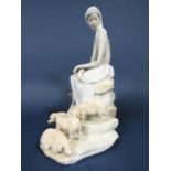 A Lladro figure of a seated girl with piglets, 28cm tall approx