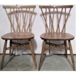A pair of Ercol dining chairs with interwoven stick backs