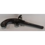 Georgian flintlock pistol with detachable barrel the walnut stock with silver wirework and carved