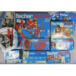 A box of Fischer Technik model building kits, transformer, spare parts, instruction books etc,
