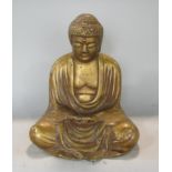 A gilt metal study of a seated Buddhistic deity, 27 cm high