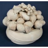 A terracotta model of a bowl of fruit including grapes, pomegranates, lemons, etc, 36cm tall approx