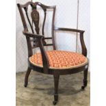 An inlaid Edwardian mahogany drawing room chair with vase shaped splat, upholstered seat and on