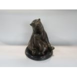 Cast bronze figural study of a polar bear and cub, upon a stepped circular black marble base,