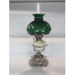 A good quality late 19th century silver plated figural oil lamp, the base cast with swans, with