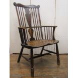 An 18th century Windsor stick back elbow chair of wide proportions, principally in elm and fruit