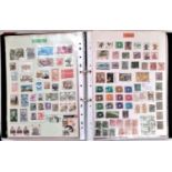 Two albums containing a collection of British and worldwide stamps, a small album containing a