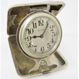 Good quality silver Elgin pocket/travel clock, the hinged silver case opening to reveal a further