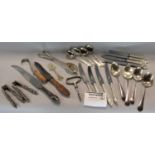 A large collection of silver plated flatware to include a fancy handled set of possibly