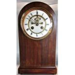 Edwardian fruitwood arched lancet mantle clock, the enamelled dial with further enamelled chapter