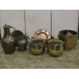 A cylindrical brass coal bin with lions mask and ring handles, brass two handled colander, an Arts &