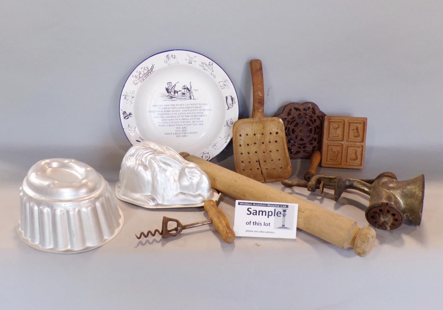 A collection of various vintage kitchenalia comprising marble boards, wooden rolling pins, enamel