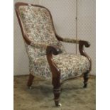 A Victorian drawing room chair with polished show wood frame, upholstered finish on turned supports