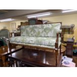 An inlaid Edwardian mahogany parlour room sofa with harebell and other detail, the back with pierced