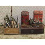A miscellaneous collection of brass letter punches, a serpentine vase, and some vintage tins (5)
