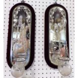 A good quality pair of venetian hanging wall sconces, with mirrored back plates and scrolled bracket