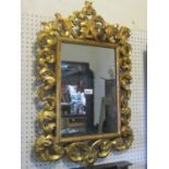 Small Florentine style gilt framed wall mirror with rectangular plate within a simple moulded