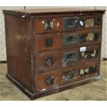 A late 19th century haberdashers counter top cabinet fitted with four frieze drawers, with