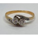 18ct diamond crossover ring, the stones 0.20cts each approx, size R/S, 2.7g