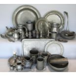 A large collection of 18th century and later English Pewter plates, candlesticks, tankards,