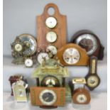 A collection of various vintage time pieces comprising a green veined mantle clock, various other