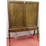 A Regency mahogany folio or print stand, raised on four swept supports, with panelled frame and well