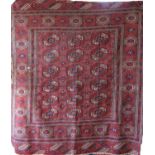 Good quality antique Turkoman rug with Bokara decoration upon a washed brick red ground, 125 x 115cm
