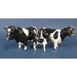 A family of three Beswick Friesian cattle comprising bull, cow and calf (3)