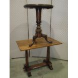 An early 20th century rectangular oak occasional table, raised on square tapered supports, with