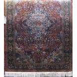 Silk blend Keshan rug with central blue medallion upon a rich orange ground, 180 x 120cm
