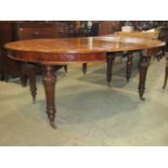A Victorian mahogany D end extending dining table raised on four turned supports, 135cm wide x 180cm