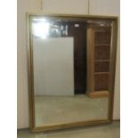 A pair of contemporary antique-style wall mirrors of rectangular form with bevelled edge plates