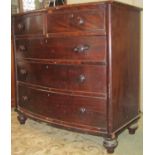 A mid Victorian period mahogany bow fronted chest of three long and two short drawers, on turned