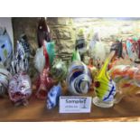 A massive collection of Murano glass fish of mainly typical form to include some paperweight