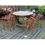 A contemporary weathered folding hardwood garden terrace table of circular form with slatted top