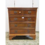 A small collection of furniture including a Queen Anne style walnut veneered chest of three