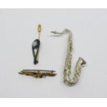 Novelty silver saxophone brooch, an antique 9ct garnet and seed pearl brooch, 2g (two pearls vacant)