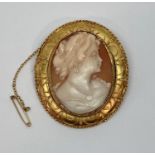 Yellow metal cameo brooch depicting a lady, 5.7 x 5cm approx, 21g