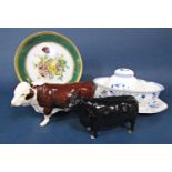 A Beswick Aberdeen Angus cow together with a Beswick Hereford bull with ring through its nose,