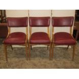 A set of six mid 20th century "Ben" chairs with swept and tapered stained beechwood frames and