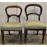 A matched set of six Victorian mahogany balloon back dining chairs, with carved splats, recently
