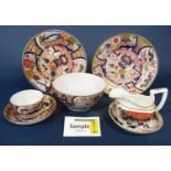 A collection of early 19th century tea and coffee wares with painted and gilded decoration in the