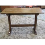 A small Victorian oak refectory/side table, raised on chamfered end supports, united by a central