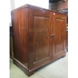 A good quality 19th century cupboard enclosed by two panelled doors, the interior revealing seven