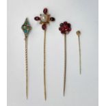 Four stick pins to include a Georgian flat cut garnet example, a yellow metal turquoise example, etc
