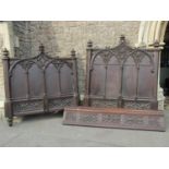 An imposing Victorian Gothic revival bedstead in oak with repeating and applied detail, set