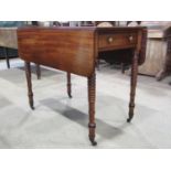 A 19th century mahogany Pembroke table on tapering bobbin supports