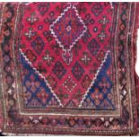 Good full pile Persian rug with central blue floral medallion framed by further floral sprays upon a