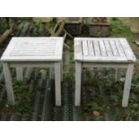 A pair of low teak garden tables of square cut form, slatted panel tops (48cm square)